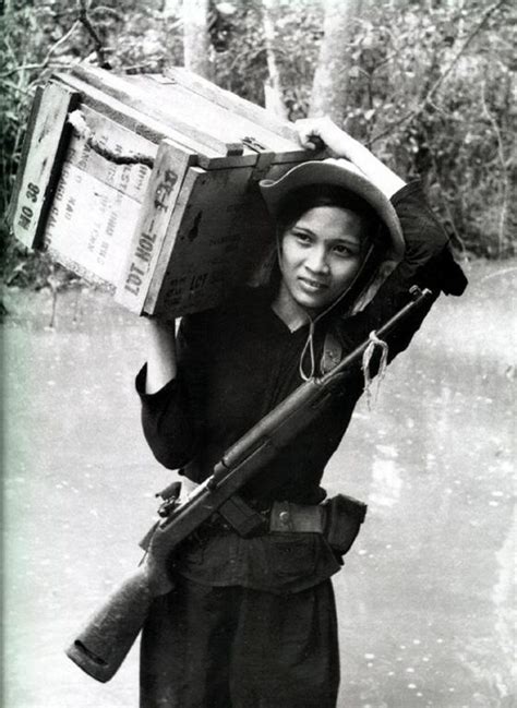 A Member Of The South Vietnamese Popular Force Carries A Crate Of
