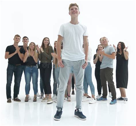 Casual Guy Standing In Front Of A Group Of Diverse Young People Stock