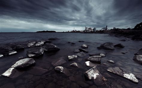 Rocky Shore Under Cloudy Sky During Daytime Hd Wallpaper Wallpaper Flare