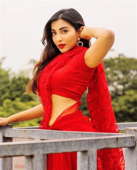 parvati nair is pretty looks in a red saree telugu rajyam