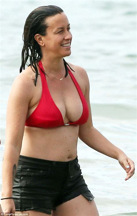 alanis morissette shows off her healthy beach body in a red bikini in hawaii daily mail online