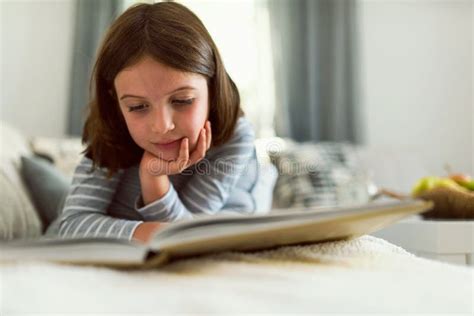 Cute Young Girl Reading Book At Home Stock Image Image Of Little