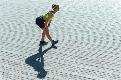 Female Runner Athlete Training Outdoors In Summer`s Sunny Day Stock