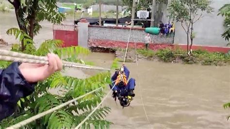 Firefighters rescue, evacuate people trapped by floods in Beijing - CGTN