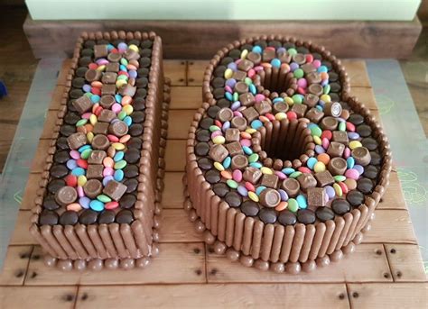 happy 18th birthday chocolate sweet cake on wood effect icing board birthday chocolates
