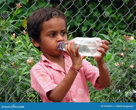 Poor Boy Drinking Water Editorial Photo 21626511