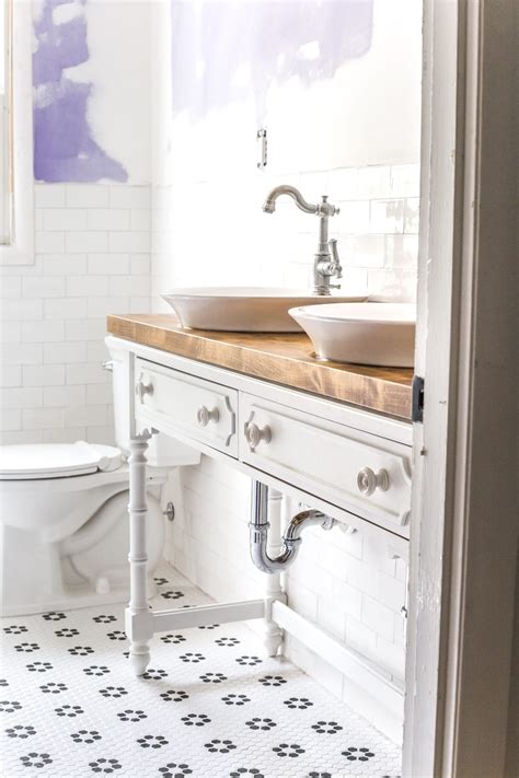 Add style and functionality to your bathroom with a bathroom vanity. How to Turn a Console Table Into a Bathroom Vanity - Bless'er House