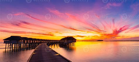 Sunset On Maldives Island Luxury Water Villas Resort And Wooden Pier