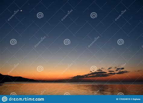 Moon And Venus After Sunset Over A Magnificent Sea Stock Image Image