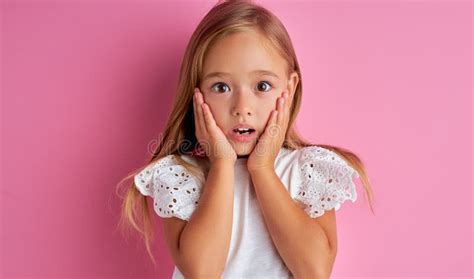 Shocked Caucasian Little Girl Look At Camera Surprised Stock Photo