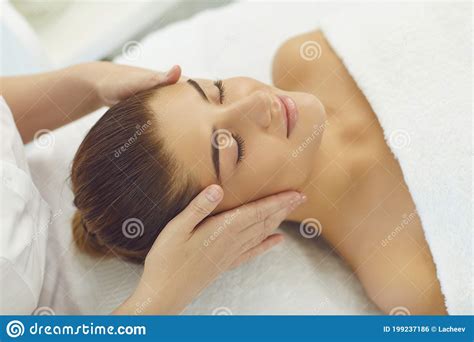 Smiling Womans Face Getting Professional Manual Relaxing Massage From Hands Of Masseur Stock