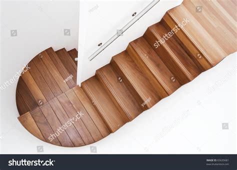Luxurious Modern Wooden Staircase With Curved Landing Wall Stock Photo