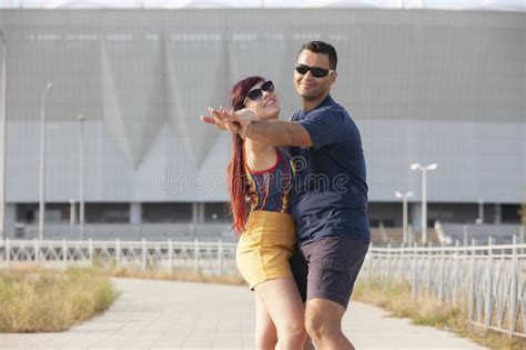 couple dancing at sunset salsa brazilian zouk lovers dance partners spinning latin festival
