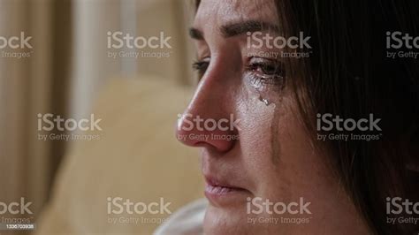 Closeup Of A Crying Young Woman With Blurry Mascara Dripping Down Her