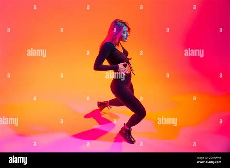 Full Length Portrait Of Beautiful Sportive Caucasian Girl Dancing Hip Hop Isolated Over Gradient