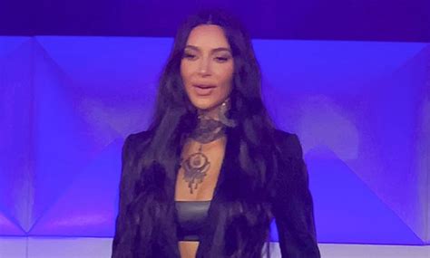 Kim Kardashian Rocks Skintight Latex Pants And Crop Top During Business
