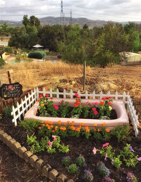 Find ideas to furnish your house. Repurposed bathtub flower bed. | Flower beds, Garden ...