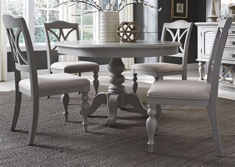 Compared to the usual table and chair configuration, a dining table with bench seating seems a bit odd and unusual. Summer House Dove Grey Round Extendable Dining Table from Liberty | Coleman Furniture
