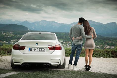 Woman And Man Hugging Each Other Beside White Bmw Car Hd Wallpaper
