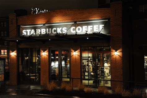 There's no sign yet, but if the lights are on, go on in. Starbucks Coffee night Capitol Hill Seattle Washington USA ...