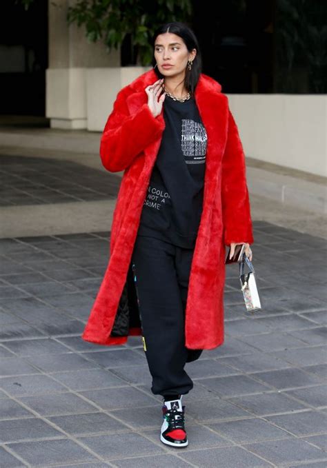 Nicole Williams In An Oversized Phillip Plein Coat With I D Rather Go