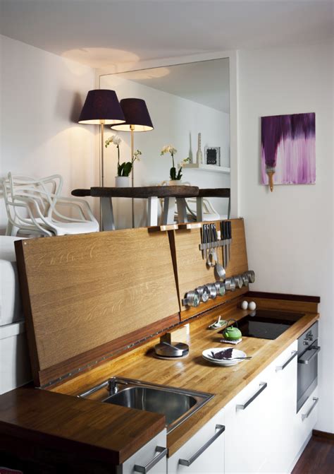 We opened up the side wall to create a more open space. Tiny Apartment Builds It Up, Pares it Down - LifeEdited
