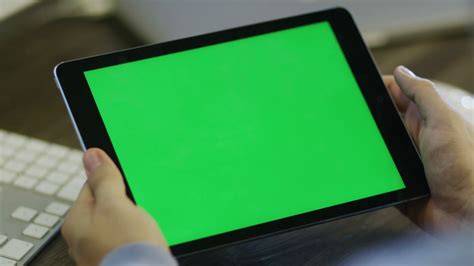 Designer using Digital Tablet with Green Screen at Work in Landscape ...