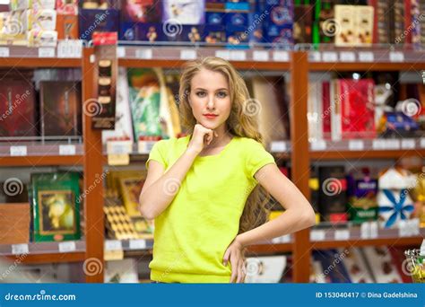 Beautiful Young Woman Shopping For Fruits And Vegetables In Produce Department Of A Grocery