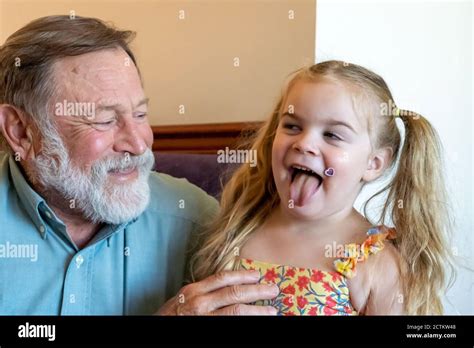 Year Old Lily Acting Silly With Grandpa Horton Stock Photo Alamy