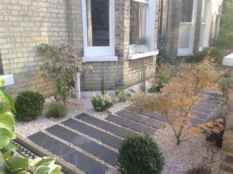 Maybe you would like to learn more about one of these? Front gravel garden with slate long slabs laid in ...