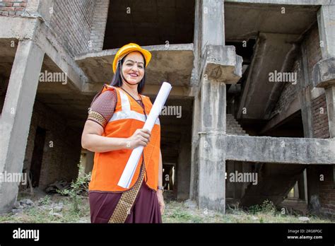 Portrait Of Confident Young Beautiful Indian Female Civil Engineer Or