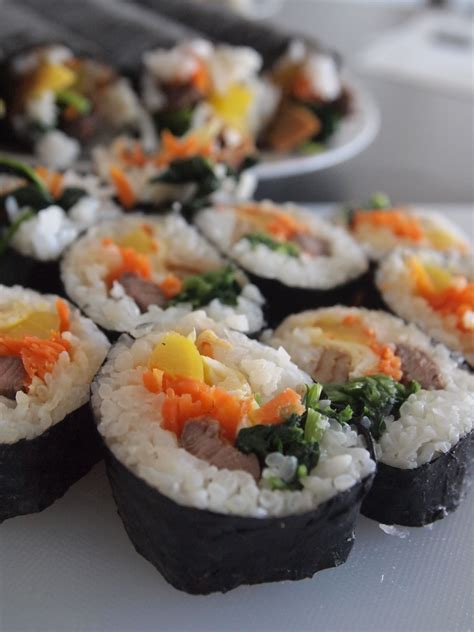 Use the fingers of both your hands to hold the filling in place as you roll with your thumbs. A Bite of Kimbap (Korean Seaweed Rice Roll) - Noms 'n Bites
