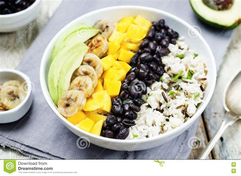 The rice is a simple mixture of mango, cilantro, bell peppers, brown rice, lime juice and green onions. Black Beans Fried Banana Mango Cilantro Rice Bowl Stock ...