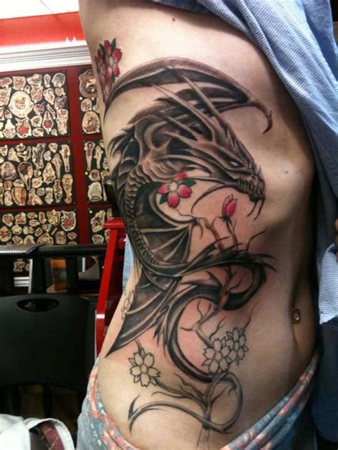 The tattoo artist was able to use shading detail to create a smoky effect, as if the dragon is rising out of a plume of smoke. 32+ Dragon Tattoo Designs | Tattoo Designs | Design Trends ...