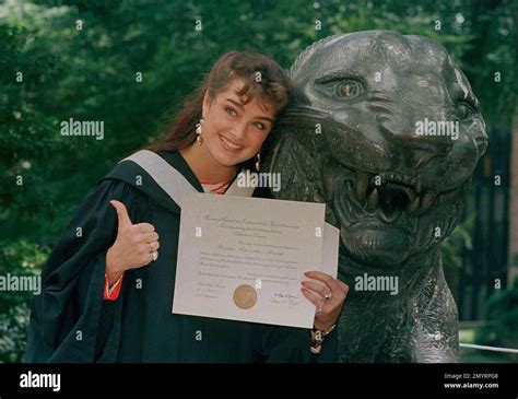 Actress Brooke Shields Gives The Thumbs Up In Her Cap And Gown As She