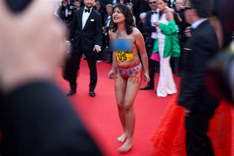 Nude Protester Interrupts Red Carpet At Cannes Film Festival