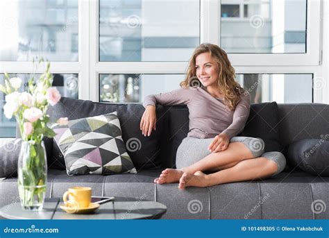 Smiling Woman Resting On Cozy Sofa Stock Image Image Of Full Female
