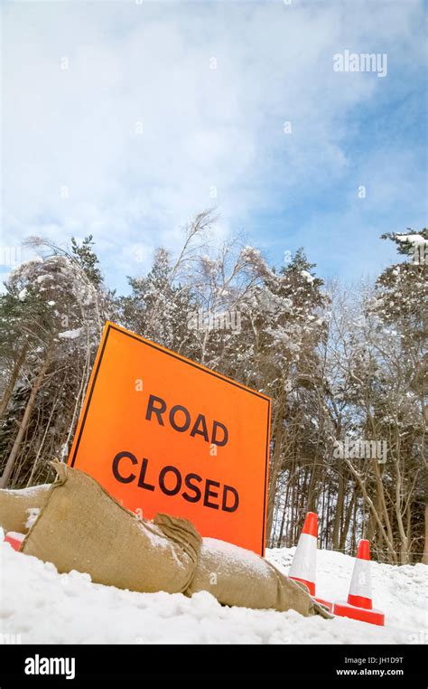 Road Closed Sign On A Snow Covered Highway Stock Photo Alamy