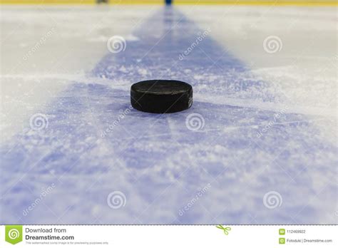 Blue Line With Puck On Ice Hockey Rink Stock Photo Image Of Lifestyle