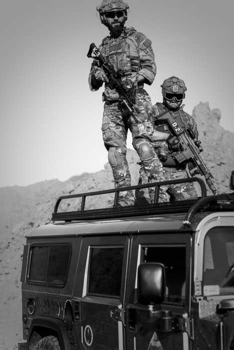 Two Soldiers On Military Vehicle In The Desert Free Image Download