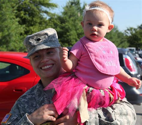 U S Army Spc Abigail Graham Holds Her Babe Emily NARA DVIDS Public Domain Archive