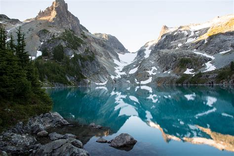 A Perfectly Calm Lake In Washingtons Cascade Range At Sunrise Oc