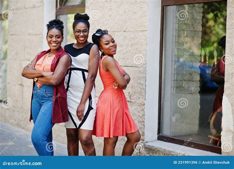 Three Stylish African American Womans Walking On Crosswalk Or Pedestrian Crossing Speaking Each