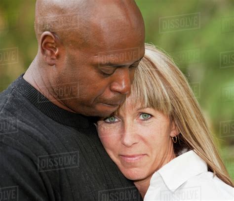 Interracial Couple Enjoying Each Others Company In A Park Edmonton