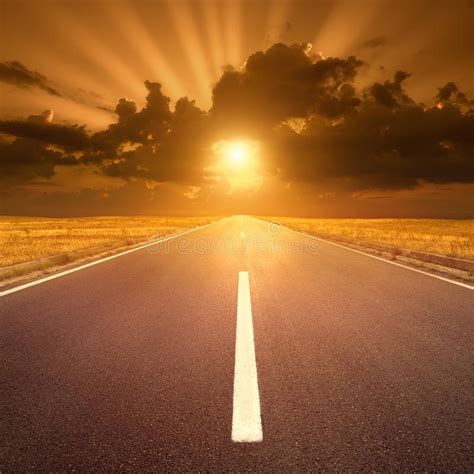 Driving On Asphalt Road At Sunset Towards The Sun Iv Stock Image