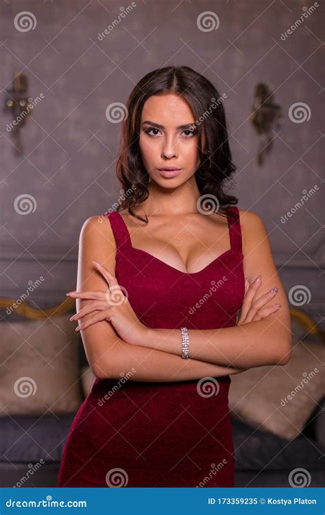 Young Beautiful Brunette Posing In A Red Dress In The Interior Stock Image Image Of Home