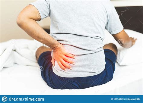 Man Suffering From Back Pain On The Bedroom Stock Image Image Of