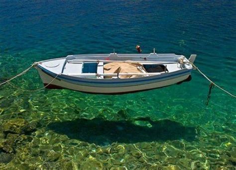 Boat Floating On The Crystal Clear Water Rpics