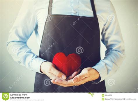 Servicing Man In Apron Holding Heart Customer Relationship And
