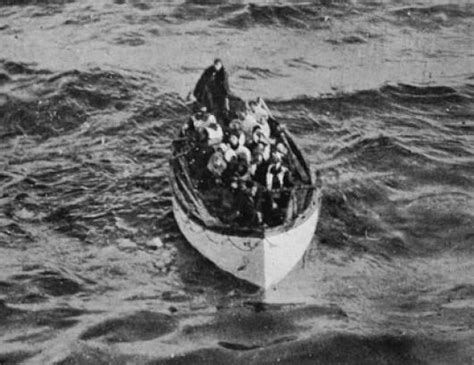 A Lifeboat Containing Passengers From The Titanic Approaches The Rms